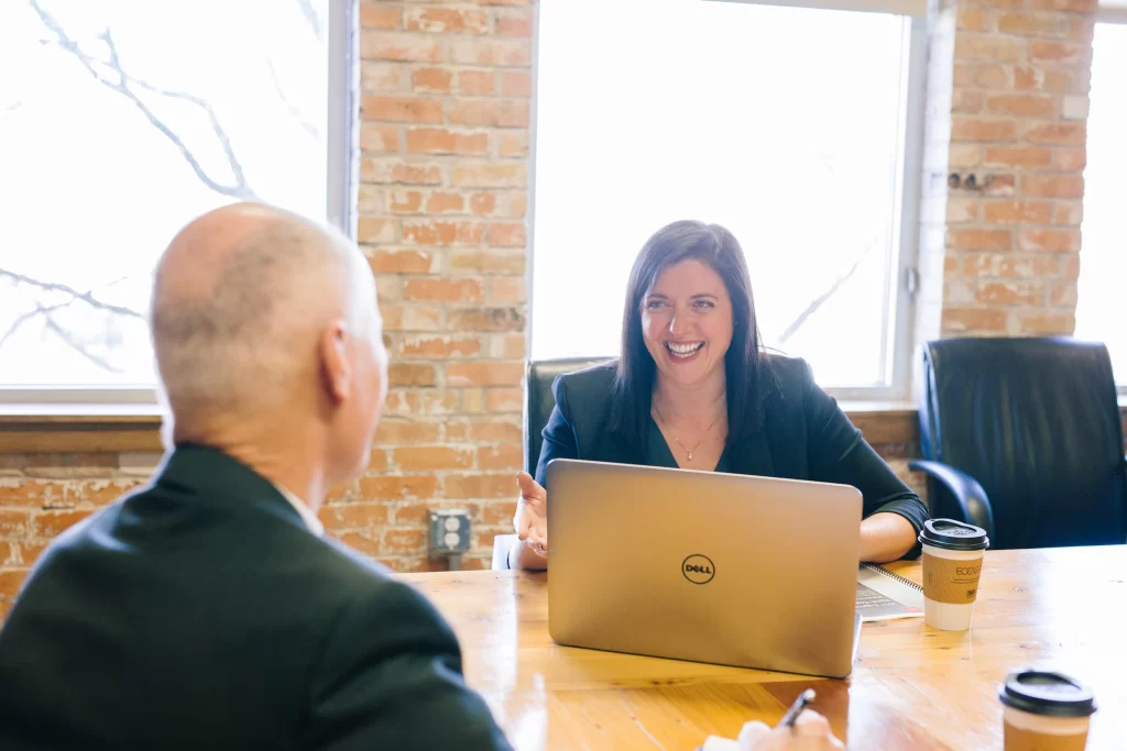 man and woman discussing debt collection services